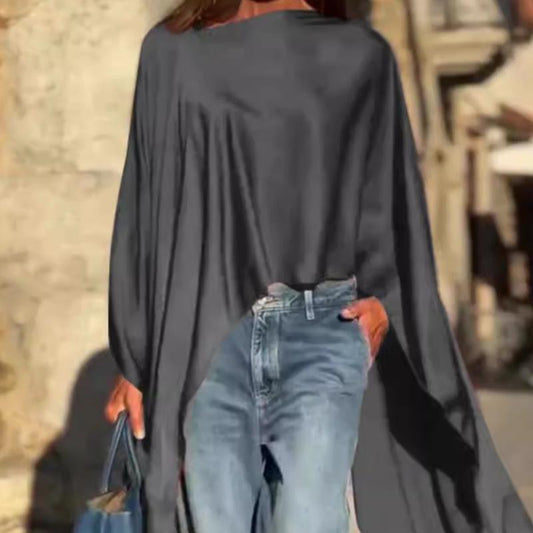 Løstsittende langermet topp med uregelmessig hem