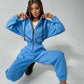 Komfortabel ensfarget jumpsuit med hette for kvinner