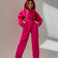 Komfortabel ensfarget jumpsuit med hette for kvinner
