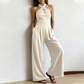 Elegant jumpsuit med kryssende halterneck