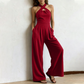 Elegant jumpsuit med kryssende halterneck