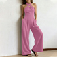 Elegant jumpsuit med kryssende halterneck