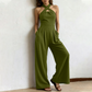 Elegant jumpsuit med kryssende halterneck