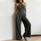 Elegant jumpsuit med kryssende halterneck